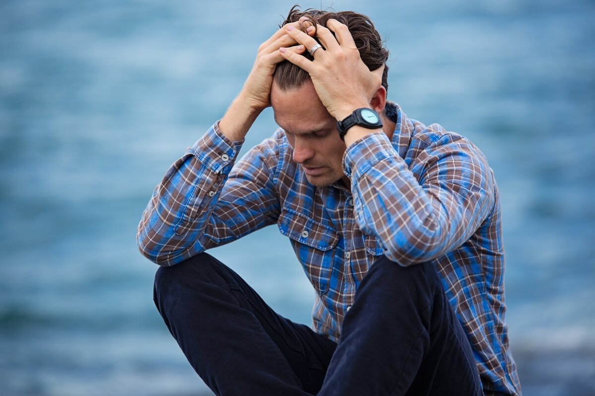 Source: https://www.pexels.com/photo/man-in-blue-and-brown-plaid-dress-shirt-touching-his-hair-897817/