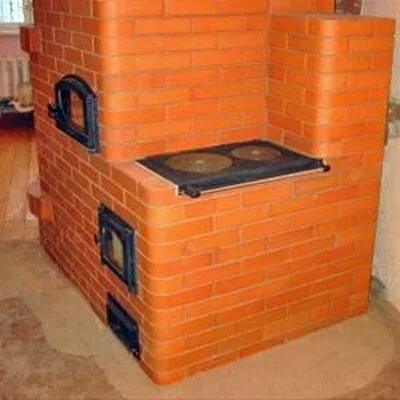 Фото 1 Такой вид у старой печи после произведенного ремонта. Здесь были заменены кирпичная кладка и поверхность для варки, верхние и нижние дверцы.
