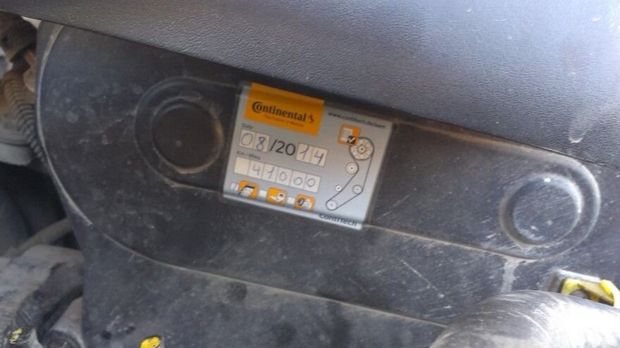 
Далее осматривайте подкапотное пространство, особенно интересно бывает взглянуть на крышку ГРМ. Обычно официальные сервисы лепят наклейку или ярлык, на котором указан пробег при замене ГРМ. Если там будет указана цифра большая чем на одометре - тут факт смотки пробега на лицо. Но бывают заранее подготовленные мошенники. Они сами специально клеят наклейку с пробегом, который больше на 20 000 км чем на одометре и если вдруг Вы это нашли, они готовы сделать скидку на автомобиль, а Вы будете считать что смотано всего 20 000, но на самом деле можно быть смотано и 100 000 км, т.е. попытка продать ушатанное ведро чуть дешевле от той суммы, которая была заявлена продавцом. 
