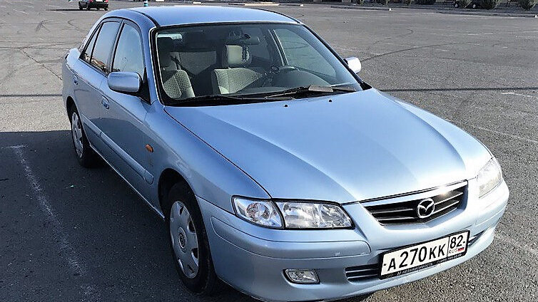2 место • Mazda 626 (2000)- Компактный автомобиль, разработанный и производившийся японской компанией Mazda Motor Corporation c 1970 по 2002 год.  • Из минусов:  слабое лакокрасочное покрытие,жестковатая подвеска, шумоизоляция . • Средняя цена в РФ ≈ 100 т.р