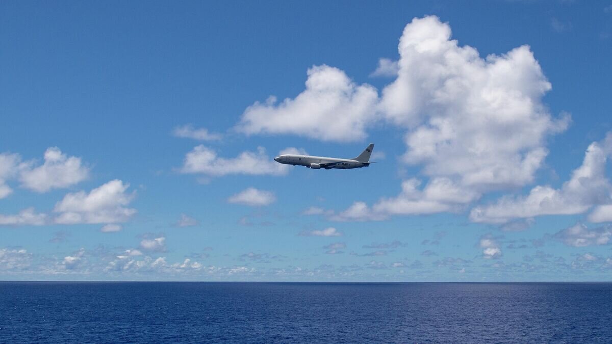    Американский самолет-разведчик P-8A Poseidon в районе острова Гуам в Тихом океане© U.S. Navy photo by Mass Communication Specialist 2nd Class Sean Rinner/Released