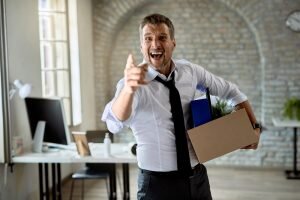    Angry businesswoman pointing at his index finger and screaming after getting fired from work. Инга Ланская