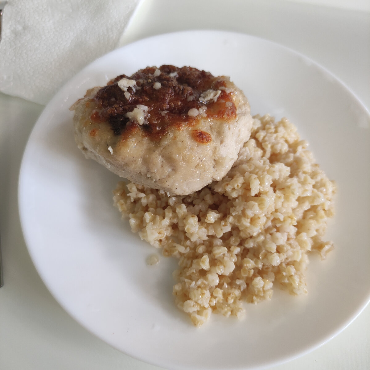 Куриная котлета с грибами и под сыром. С кашей пшеничной. Котлета на самом деле довольно-таки большая. 