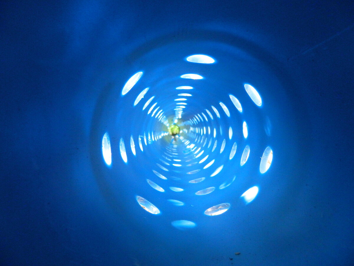 Перфорированный участок нПВХ трубы (заготовка под фильтр). Вид изнутри в солнечный день :)