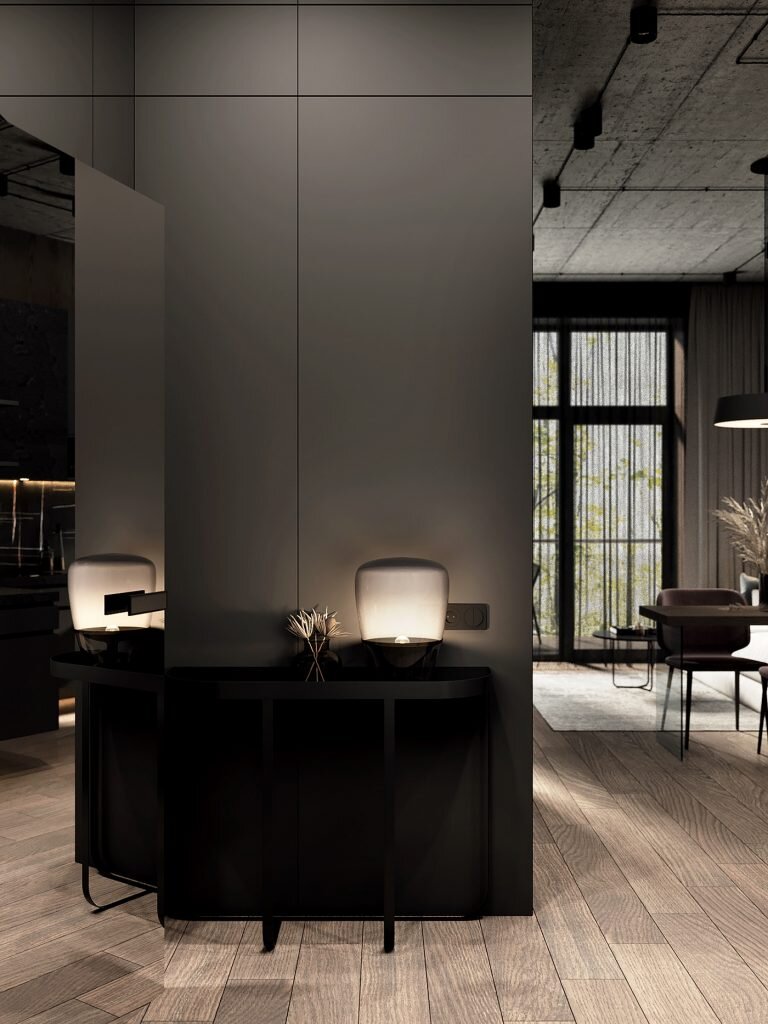 Почти все стены в этой двухкомнатной квартире площадью 53 метра оформлены настенными панелями — деревянными или сложного серого оттенка.