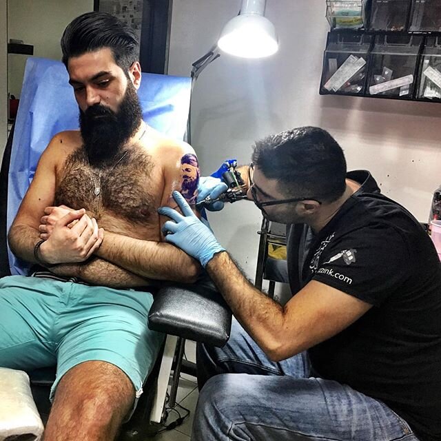 Jivan Hagopian, a 24-year-old barber from Jordan, getting a tattoo portrait of himself at @huzzink