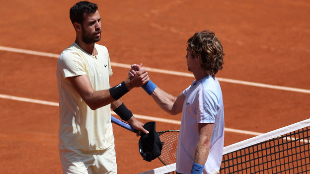    Карен Хачанов (слева) и Андрей Рублев. Reuters