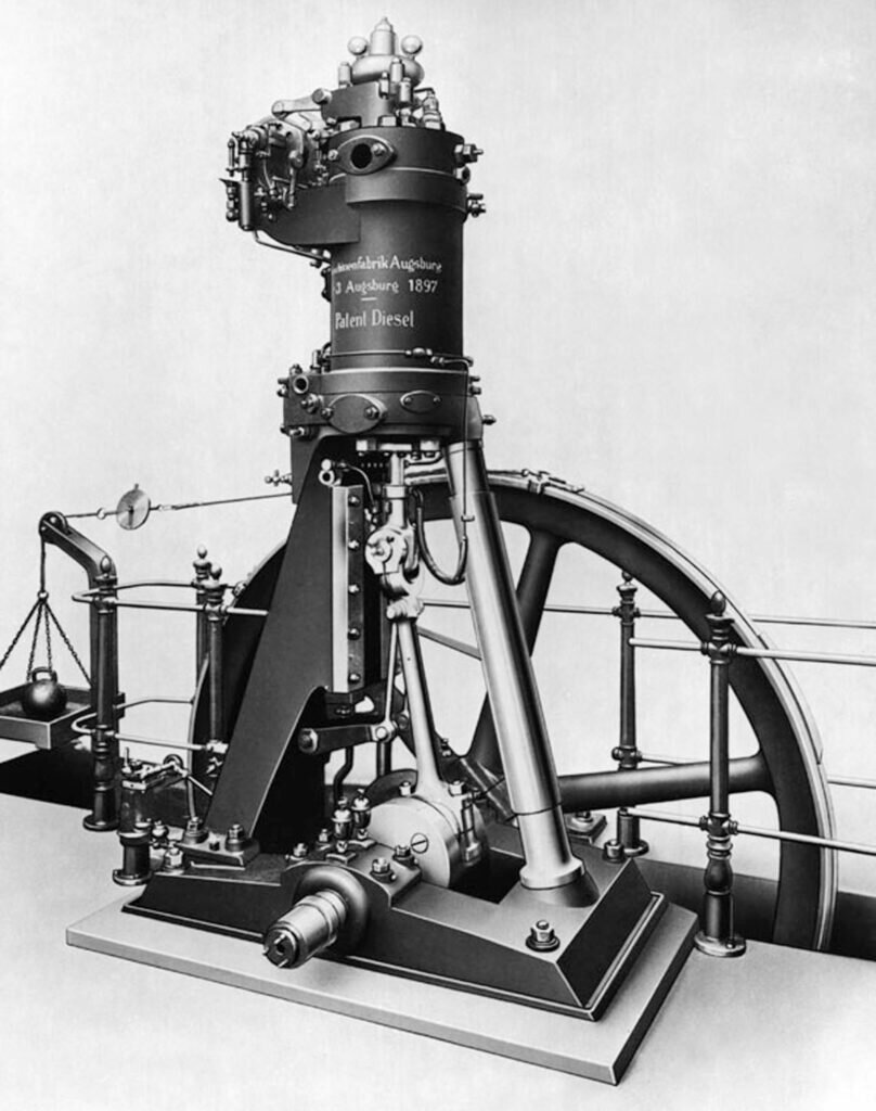 Первый двигатель Дизеля. Видны динамометр и гиря для замера крутящего момента на маховике. Архив MAN AG