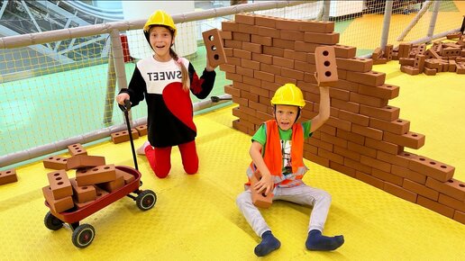 Sofia and Max in a Children's center play on a Construction playground