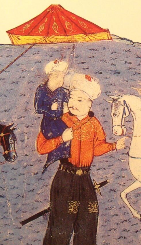 Ильхан Аргун с сыном Газаном на руках. 