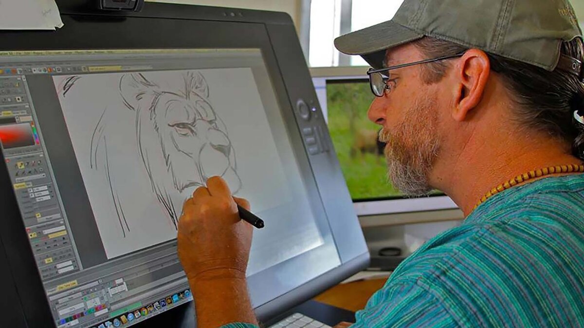 художник работает за графическим компьютером