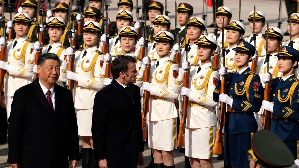    Эмманюэль Макрон и Си Цзиньпин:Ng Han Guan - Pool / Getty Images
