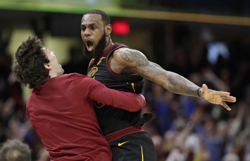 Cleveland Cavaliers’ LeBron James, right, celebrates with Cedi Osman, from Turkey, after James shot a game-winning three point shot in the second half of Game 5 of an NBA basketball first-round playoff series, Wednesday, April 25, 2018, in Cleveland. The Cavaliers won 98-95.