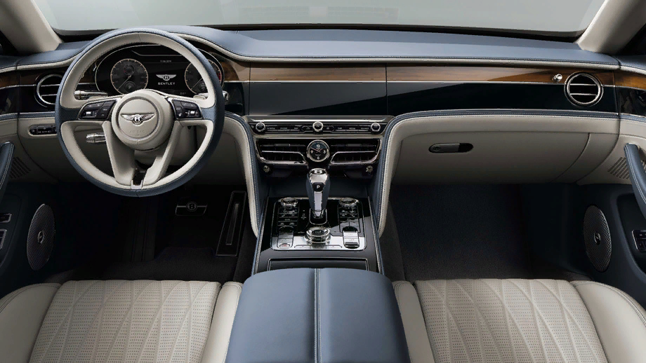 Внутреннее убранство седана почти полностью повторяет купе Continental GT, но центральные дефлекторы около часов получили другую форму. Над часами, как и в купе, появилась вращающаяся трёхгранная призма, одна сторона которой представляет собой чистый деревянный шпон, вторая являет три аналоговых циферблата, а третья — сенсорный экран с диагональю 12,3 дюйма.