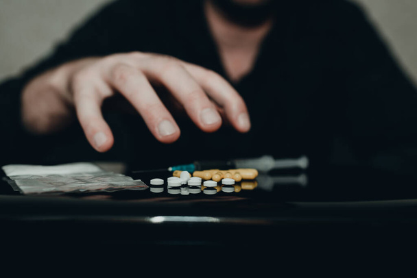 https://cdn.create.vista.com/api/media/small/533969824/stock-photo-drug-addict-hand-reaches-heroin