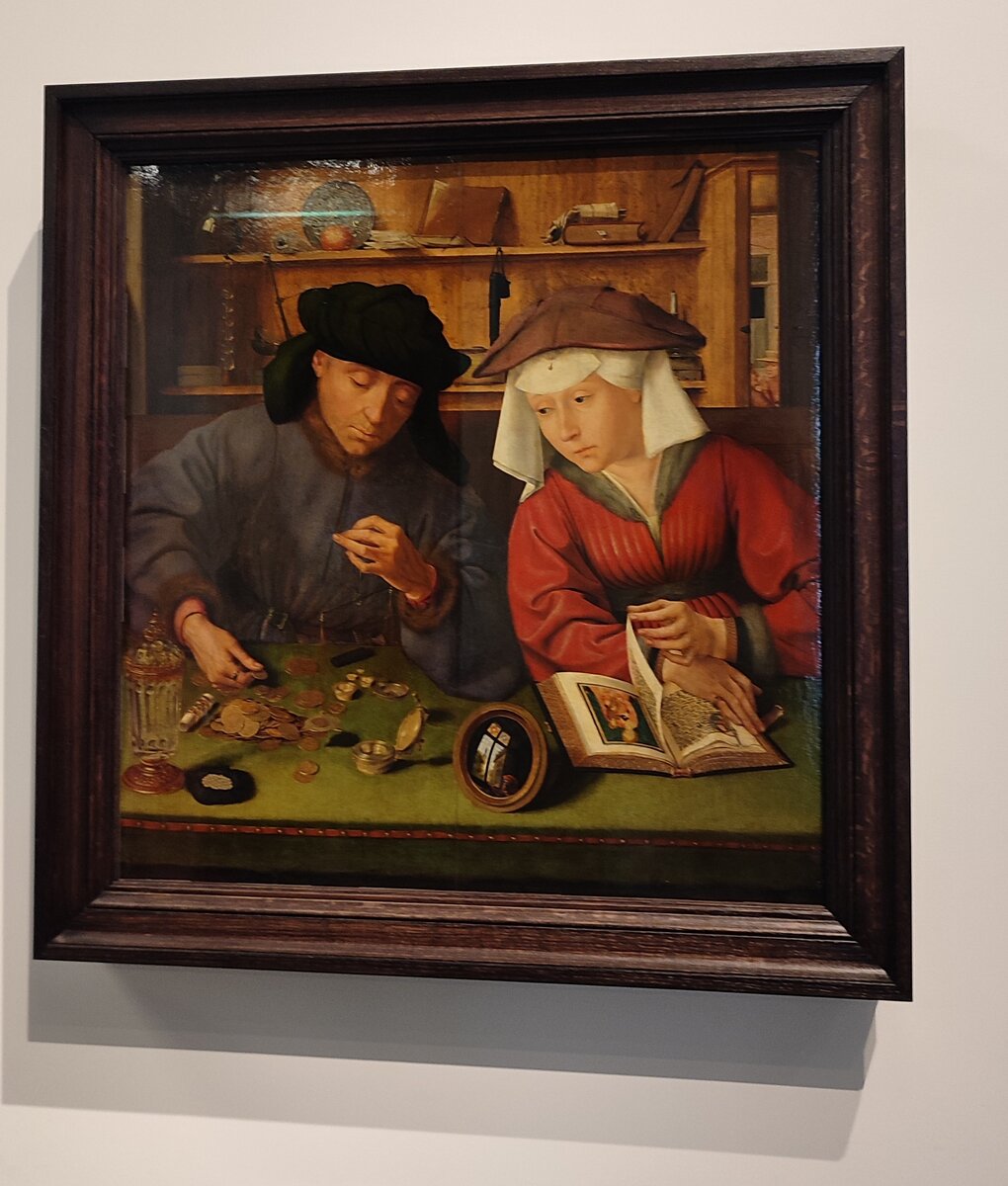 Меняла и его жена. Квентин Матсис, Фландрия. 1514 г. Масло, дерево.