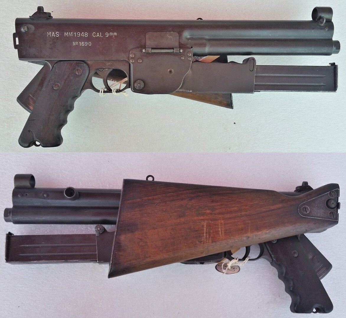 Пистолет-пулемет МАС-48 в сложенном виде. Обратите внимание на выжимную скобу-предохранитель и крышку, закрывающую окно для экстракции гильз.