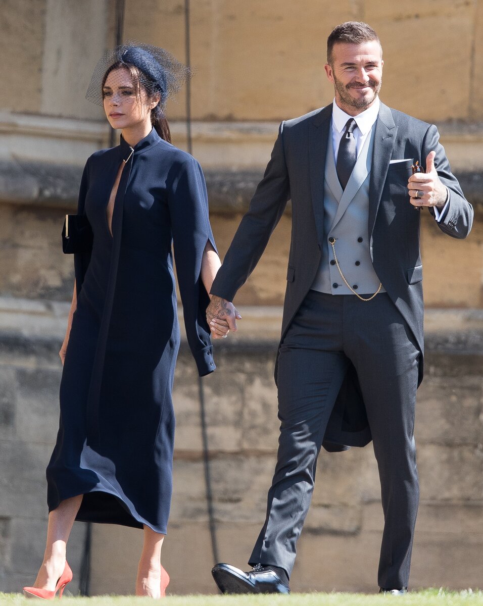    Бекхэмы на свадьбе Гарри и Меган в 2018 году. Фото: Getty Images