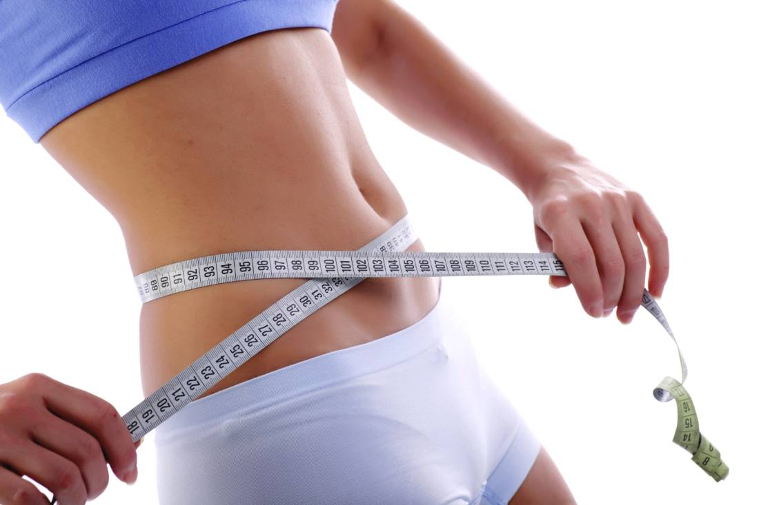 Lose weight. Снижение веса. Для похудения. Девушка с сантиметром на талии. Снижение лишнего веса